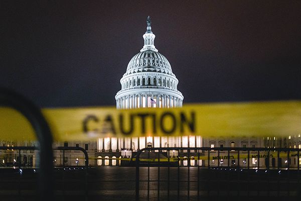 Photo of US Capitol with caution tape in foreground
